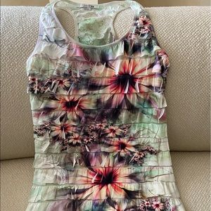 Sleeveless racer back ruffled multi colored flower patterned top.EUC!